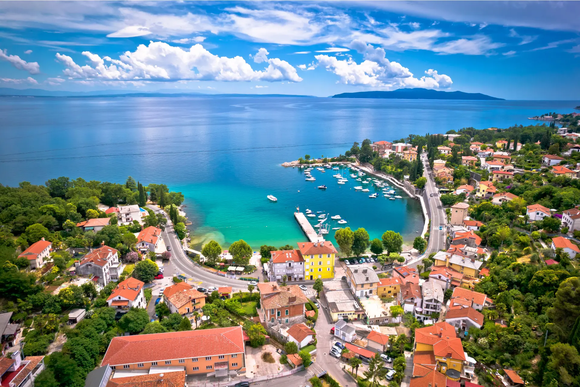 Aerial view of a coastal town with colorful houses, Kvarner, Croatia.