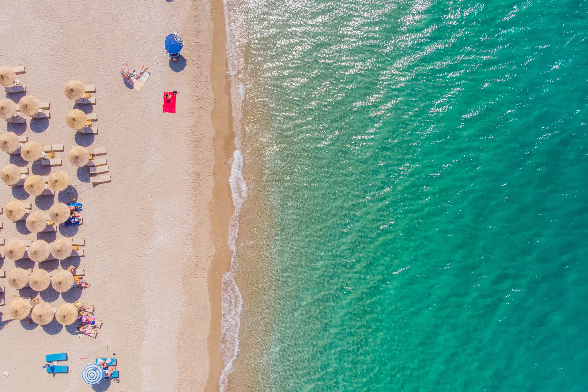 Aerial view of a sandy beach and clear turquoise waters in Zadar, Croatia