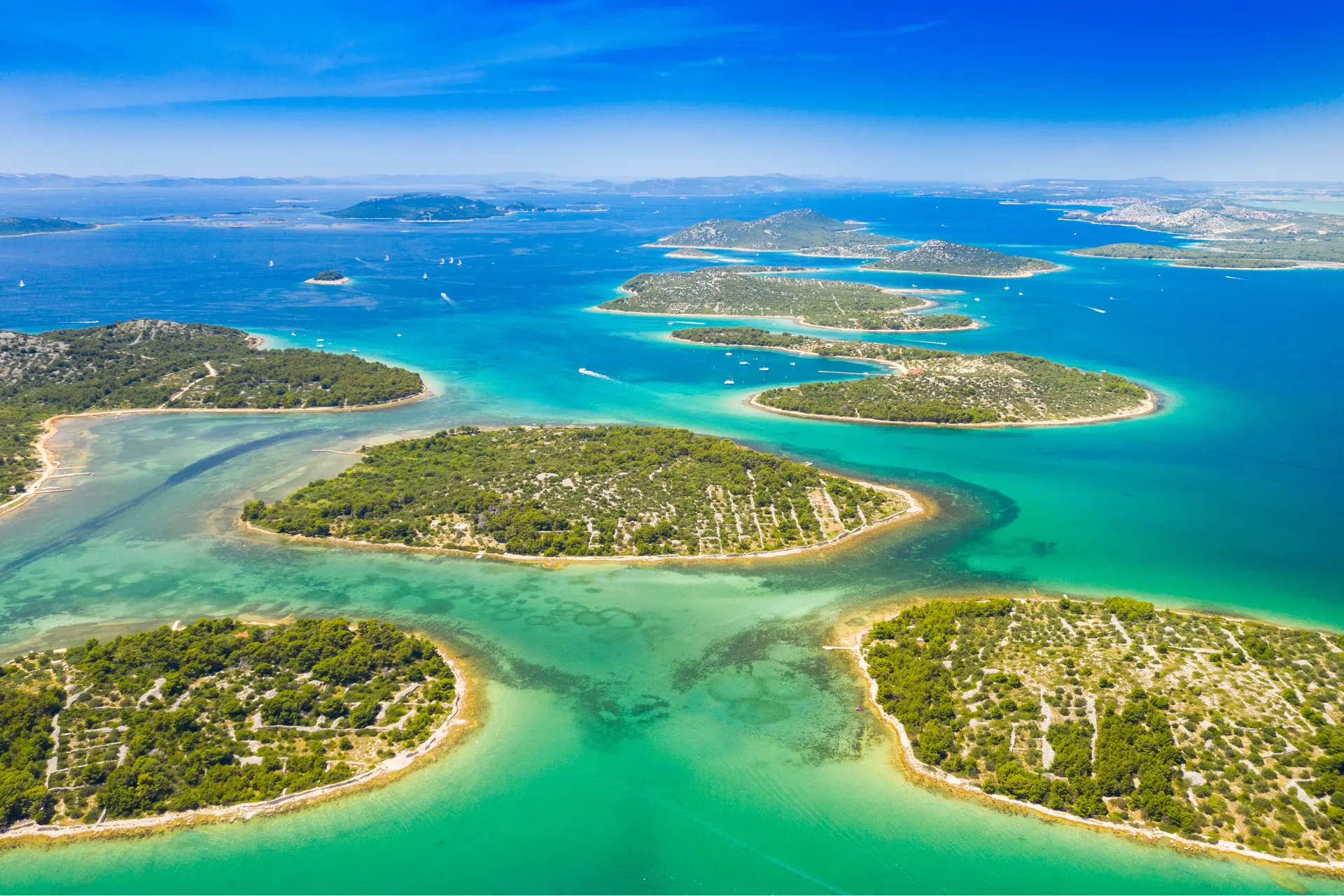 Aerial view of the Murter archipelago, Croatia, with turquoise waters and lush islands